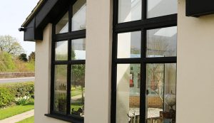 Black colour uPVC windows with bespoke angle shape