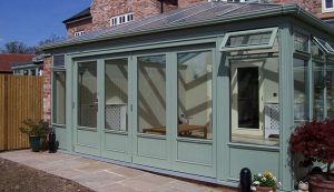 Green timber bifold doors