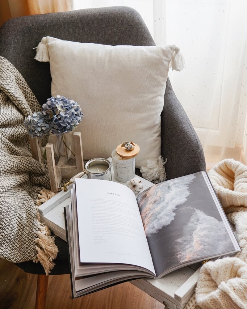 Comfy cushion, book and candle