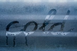 Cold written on a window in condensation