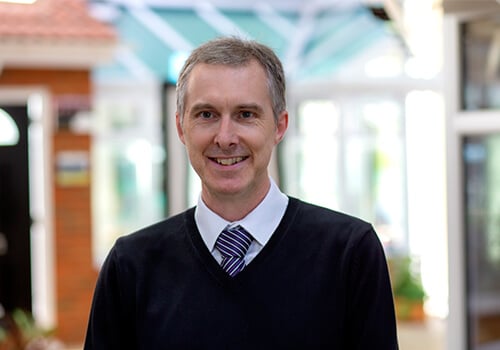 Image of Andrew Briggs with a jumper on.