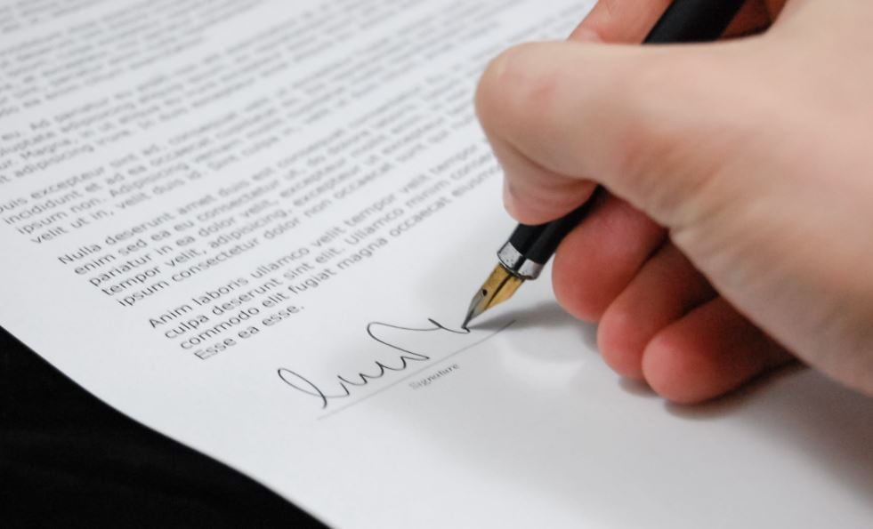 Signing Deposit paperwork.