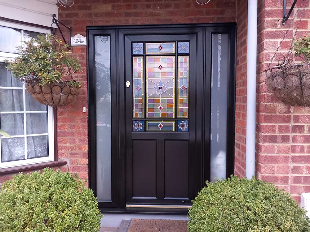 black front door with decorative glass