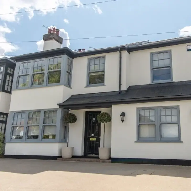 Grey vertical sliding windows totally transform home